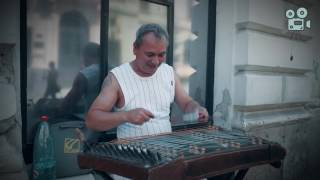 Street artist with his old hammered dulcimer in Bucharest  old city [upl. by Elocal339]