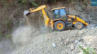 New JCB ecoXcellence BackhoeMaking Narrow RoadCutting Stony Hill [upl. by Eneryc]