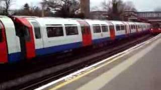 Two Piccadilly line tube trains arrive at Osterley station [upl. by Pampuch45]