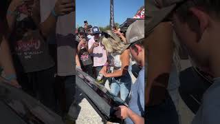 Lindsay Bercosky signing a tail gate with an angle grinder automobile [upl. by Aihsirt940]