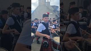 Dufftown Highland Games massed pipe bands march from Games field to Clock tower 29th July 2023 [upl. by Corene]