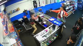 VIDEO Gun battle breaks out between store employee and wouldbe robbers [upl. by Gmur]