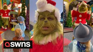 Grinch impersonator has hilarious interaction with two young children  SWNS [upl. by Naryt]