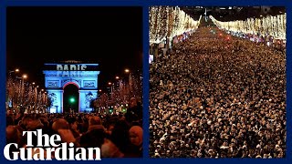 More than 1m people gather in Paris to watch New Years Eve firework display [upl. by Luhey783]