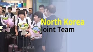 North Korean table tennis players arrive in South Korea with bouquets in hand [upl. by Branch74]