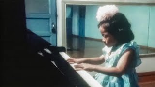 North Korean girl playing Internationale on Piano 1986 [upl. by Hum766]