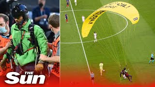 Parachute protester crash lands into Euro 2020 game hospitalising football fans [upl. by Ellimak319]