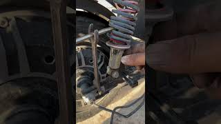 Battery car shock absorber spring adjustment process [upl. by Erdreid589]