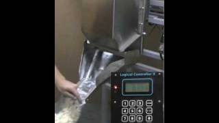 Popcorn Filling Machine Logical Machines S4 weigh fill system demonstration 4 oz popped popcorn [upl. by Boccaj]