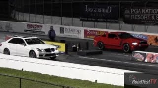 2013 Boss 302 vs 2012 Mercedes E63 AMG BiTurbo w RENNtech Tune  Drag Race  Road Test TV ® [upl. by Rosanne]