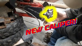 2004 polaris sportsman 700 rear brake caliper install and bleeding [upl. by Heinrike]