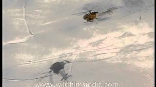 Helicopter shadows falling on the snow laden Himalayas [upl. by Chico]