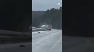 Semitrailer truck crashes into guardrails on icy Alabama highway  shorts caughtoncamera [upl. by Enyahs]