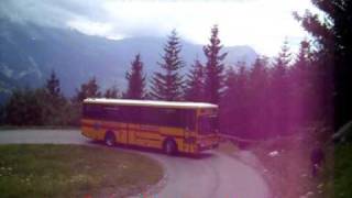 A Swiss postbus in Grindelwald [upl. by Airotal]