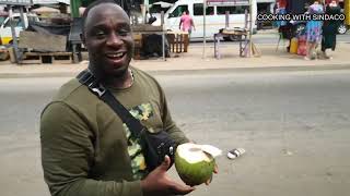 Trying Fresh Coconut Water and Sugar Cane on the Streets of Ghana [upl. by Tripp]