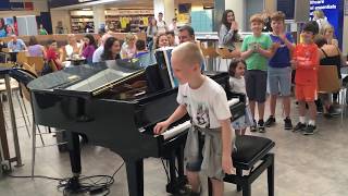 Amazing airport pianist Harrison aged 11 plays Ludovico Einaudi cover Nuvole Bianche [upl. by Lleuqar]