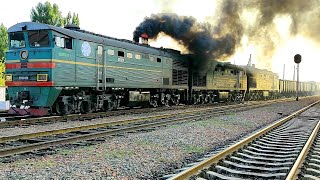 Diesel locomotive 2TE10V4661 with a freight train fire and black smoke covers the sky [upl. by Tebasile]