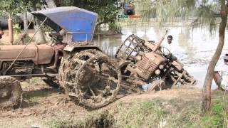 Tractor Falls off Trailer  Motor Vehicle with Large Rear Wheels Driver Precarious Challenge Tricks [upl. by Janela]