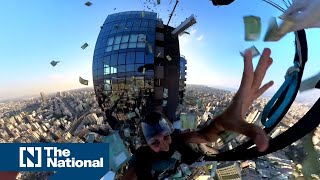 It’s raining money Lebanons only BASE jumper fills sky with worthless cash [upl. by Gelman]