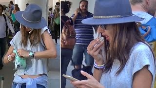 Alessandra Ambrosio Makes Eating Popcorn Look Sexy At LAX [upl. by Childs219]