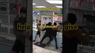 Thief distracts phone shop owner while thugs rob shop [upl. by Bradford326]