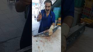 Filleting barracuda with a big knife at the fish market [upl. by Michail]