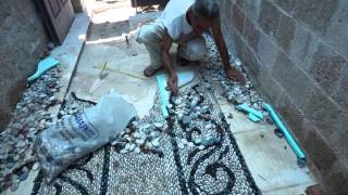 Traditional Greek pebblestone mosaic artist Stelios Grekos at work [upl. by Tallou125]