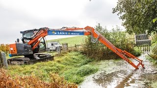 Hitachi ZX85US5 long reach carries out flood prevention work [upl. by Nnaasil605]