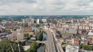 Dolly zoom Ghent Belgium Esco Scheldt river embankment Panorama of the city from the air C [upl. by Yevoc]