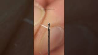 Threading a needle closeup [upl. by Belamy]