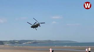 Moment lowflying Chinook helicopter thunders over Welsh beach [upl. by Amorette]