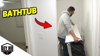 Fitting bathroom tub Day 105 DIY mobile home renovation journey [upl. by Strephonn]