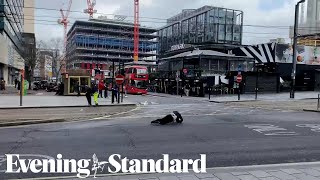 Pedestrians fall over in strong winds as Storm Eunice hits the UK [upl. by Idrahs]