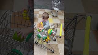 12424 Carson putting stuff into shopping cart at Iowa children’s museum [upl. by Aeiram]