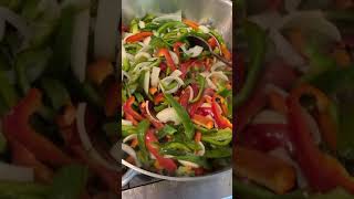 Cooking sautéed onions and peppers [upl. by Noreik]