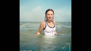 Geri Horner 52 shows off her incredible figure in a white swimsuit as she enjoys a dip in the sea [upl. by Irene]