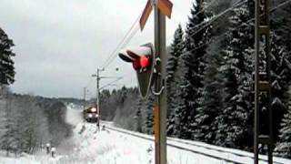 NetRail freight train pulled by Ma 825 Electric locomotive passing a level crossing at Bystad [upl. by Rentschler393]