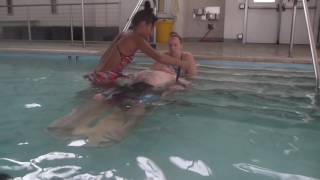 Lifeguarding Drill Backboarding with Extrication off Stairs [upl. by Nivad994]