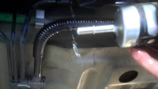 Fuel filter replacement 2005 Ford Focus Install or Remove and replace gas filter [upl. by Alehs]