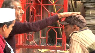 Hindu priest tying a sacred thread and blessing devotees [upl. by Asi]