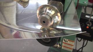 Lazze Metal Shaping Stainless Steel Panel in the Bead Roller [upl. by Pudendas151]