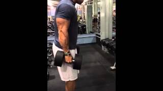 Worlds Tallest Bodybuilder 100 DB curls [upl. by Aicatsanna49]