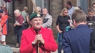 Dufftown Highland Games July 2023 massed pipe bands march from the clock tower to the Games park [upl. by Ahsenev]