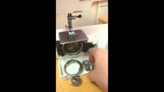 How to pull apart and reassemble the bobbin case area on a front loading sewing machine [upl. by Ransell]