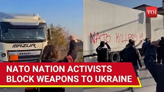 NATO Killers Go Home Europe Protesters Storm Trucks Carrying Weapons For Ukraine In Greece [upl. by Schaefer]