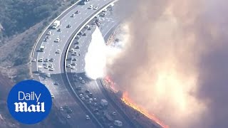 Helicopter battles new fire along Simi Valley California highway [upl. by Lowndes]