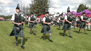 Pipe Major Cooper leads Ballater Pipe Band on the march during 2023 Dufftown Highland Games [upl. by Ycram]