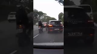 Motorcycle collides with Porsche on AYE driver opens door leading to second crash [upl. by Ainnat972]