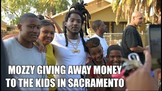 MOZZY GIVES AWAY MONEY TO THE KIDS IN HIS HOOD WHILE SHOOTING OVERCAME  OAK PARK SACRAMENTO [upl. by Delaney47]