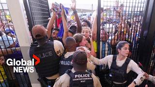 Copa America Ticketless fans climb through air vents over fence in attempt to get in stadium [upl. by Serafine]